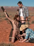 Slutty Amber Rayne Is Gagged, Tied Up And Pinched With Pegs In The Desert Where She Sucks Two Di